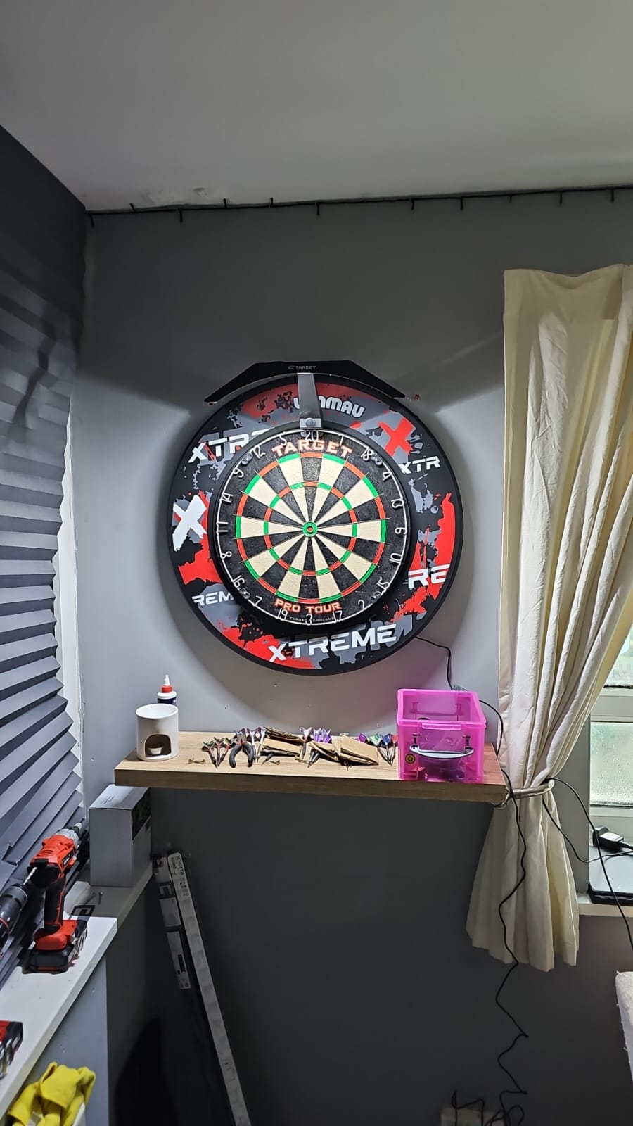 #dartstopper Husband's new darts setup. Thanks to you for the new surround and board light! He is very happy now 😊 